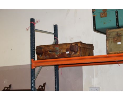 A VINTAGE LEATHER SUITCASE 