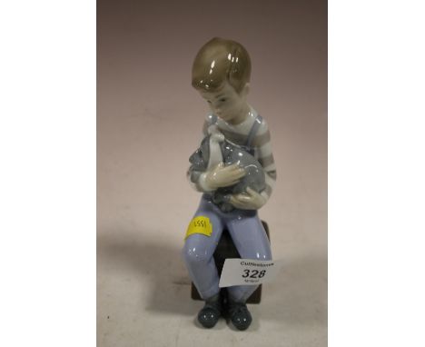 A NAO SEATED BOY FIGURE 