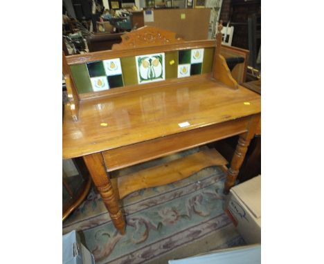 AN ANTIQUE PINE TILE BACK WASHSTAND