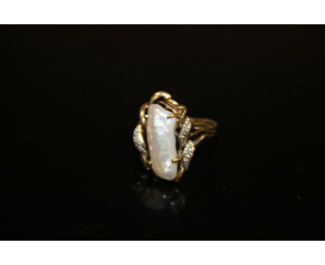 A 9 CARAT GOLD DRESS RING SET WITH A LARGE RECTANGULAR PEARL AND DIAMONDS 