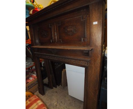 A LARGE WOODEN MANTELPIECE / FIRE SURROUND