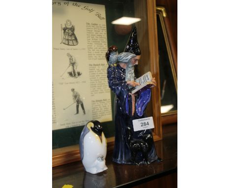 ROYAL DOULTON WIZARD FIGURE HN2877 TOGETHER WITH A ROYAL WORCESTER 'FIRST STEPS' PENGUIN FIGURE
