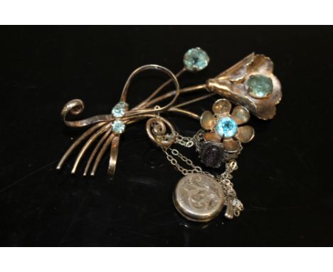 A LARGE SILVER FLORAL BROOCH, LOCKET AND A RING (3)