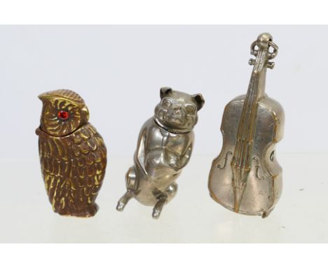 Three novelty vesta cases comprising a silver plated example in the form of a violin, a further plated case in the form of a 