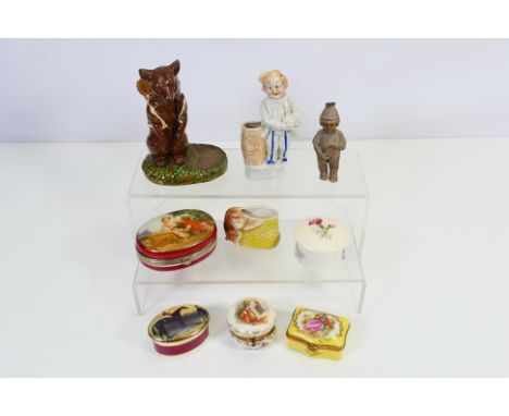 Lot to include two table vestas, one in the form of a standing bear with a basket on it's back, trinket boxes and similar. [W