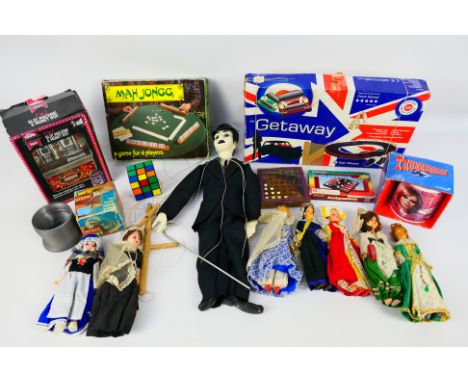 Thunderbirds - Charlie Chaplin - Rubiks - A collection of items including a Charlie Chaplin marionette, a slinky spring, a Ru