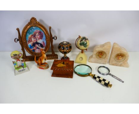 Lot to include small terrestrial globe, enamelled pedestal trinket box, magnifying glasses, Guinness kangaroo figure and othe