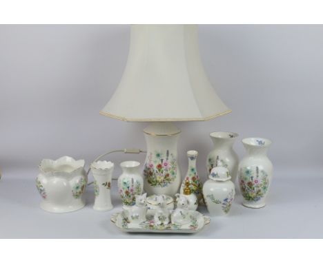 Aynsley - A collection of ornamental wares decorated in the Wild Tudor pattern to include table lamp, vases, bowl, animal fig