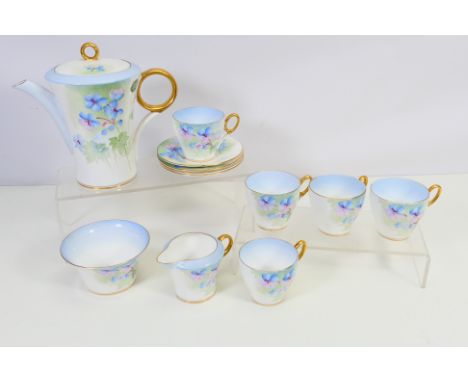 A quantity of Shelley tea wares decorated with pink and blue flowers with gilt rims and handles, pattern C12515, thirteen pie