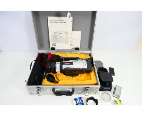 Photography - A Canon XM2 3CCD Digital Video Camcorder, contained in a flight case with accessories. [W]
