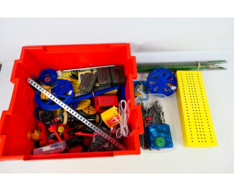 Meccano - An quantity of loose Meccano pieces to include wheels, axles, angle girders and others. Lot also include 2 storage 