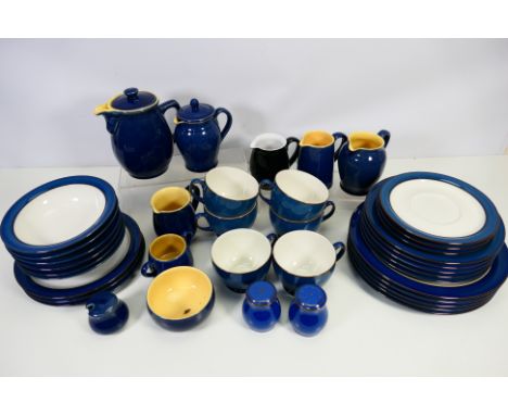 A quantity of Denby Stoneware table wares, approximately 40 pieces. [W]

NOTE: IN HOUSE SHIPPING IS NOT AVAILABLE FOR THIS LO