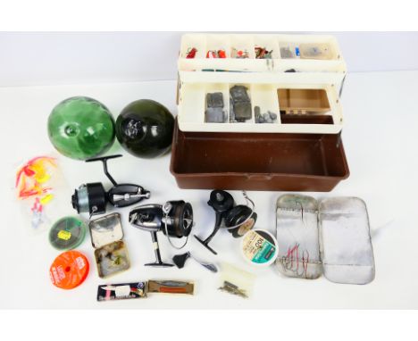 A quantity of fishing equipment including reels with two green glass fishing floats, approximately 5" (d), one marked British