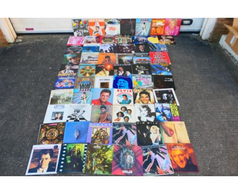 A collection of "12 vinyl records to include Al Green, Robert Palmer, Michael Jackson, Yes, The Eagles and other [W]
