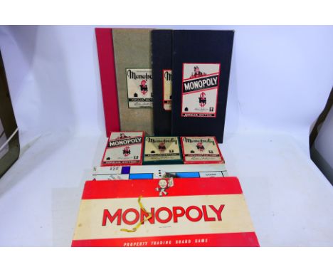Monopoly, Parker Brothers - A collection of five sets of Monopoly, two in boxes, three boxes and boards separate (Popular edi