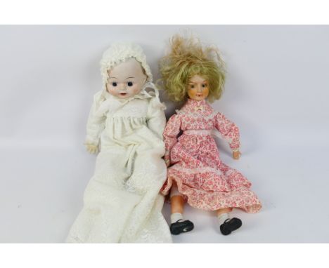 Unknown Maker -  Porcelaine - Dolls - A pair of unboxed porcelain dolls in excellent condition. Lot includes a 42cm Doll with