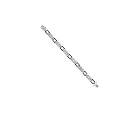 Diamond and enamel bracelet, circa 1920The pierced plaques set with old brilliant and single-cut diamonds with alternating bl