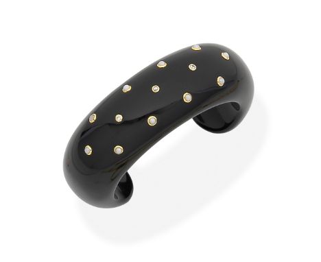 TIFFANY: Onyx, seed pearl and diamond bangleThe onyx cuff with seed pearl and diamond studs, inner diameters 5.6cm x 4.2cm, m