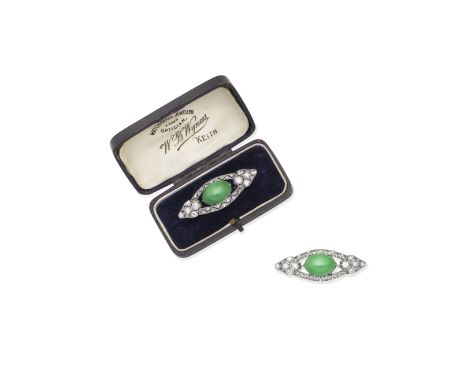 Jade and diamond brooch, circa 1920The oval cabochon jade set within a pierced plaque of old brilliant and single-cut diamond