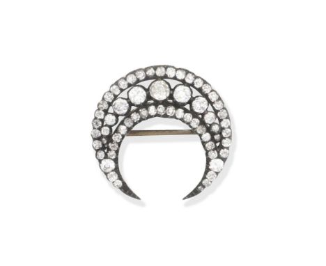 Diamond crescent brooch, Circa 1890Set throughout with cushion-shaped diamonds, mounted in silver and gold, detachable brooch