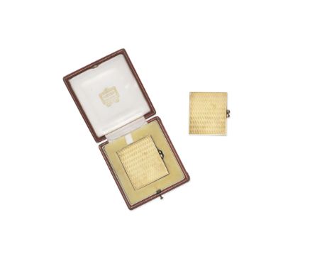 Cartier: Gold travelling photograph frame,  1960The hinged frame of textured finish, with cabochon-cut sapphire set clasp,  m