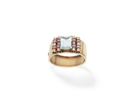 Aquamarine, ruby and diamond bangle, circa 1940The hinged gold bangle set to the centre with a step-cut aquamarine, the scrol