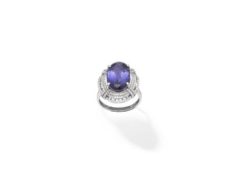 Tanzanite and diamond ringThe oval-cut tanzanite weighing 9.23 carats, within a tiered surround of single-cut diamonds, ring 