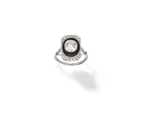 Diamond and onyx ring, circa 1930Set to the centre with a cushion-shaped diamond within an onyx surround, further set with si