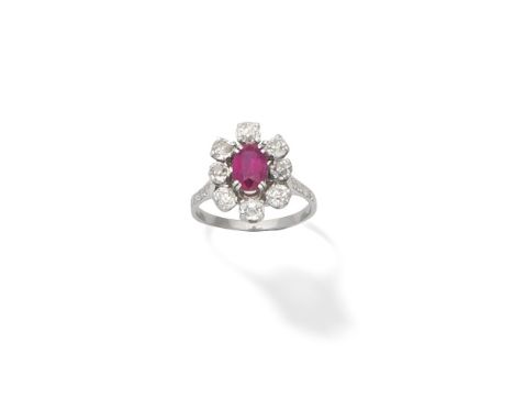 Ruby and diamond cluster ringThe oval-cut ruby within a surround of cushion-shaped diamonds, with single-cut diamond shoulder
