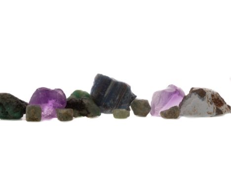 **COLLECTION OF ROUGH GEMSTONES, including blue opal, amethyst, green sapphire and emeralds, in excess of 267 carats