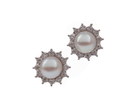 PAIR OF PEARL AND DIAMOND STUD EARRINGS, the spherical pearls within round brilliant cut diamond halos, in nine carat white g