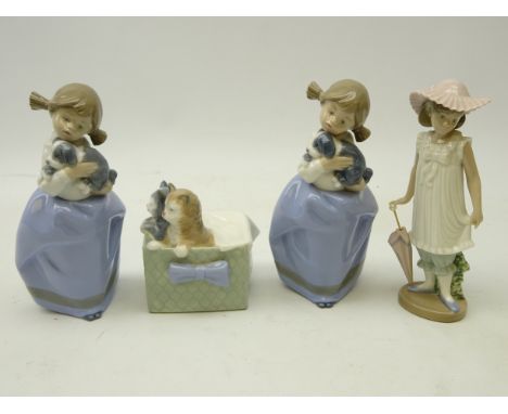 Four Nao figurines; Kittens in a basket No. 1080, girl holding a puppy, another similar and a girl with parasol (4)   Conditi