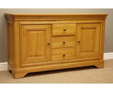 Solid light oak sideboard, two panelled cupboards and three drawers, W151cm, H86cm, D48cm   Condition Report   Click here for