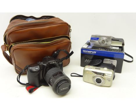 Minolta 400si SLR camera with AF 70-210 Zoom lens, additional lens, instructions, cleaning kit and ten rolls of 35mm film in 