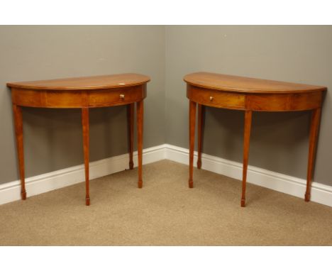 Pair yew wood demi-lune console tables with single drawers, on square tapering supports with spade feet, carved with owl moti