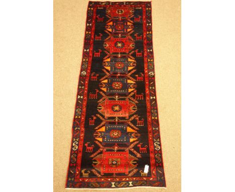 Small Caucasian multicoloured runner, geometric & styalised animal field within repeating border, 248cm x 90cm    Condition R