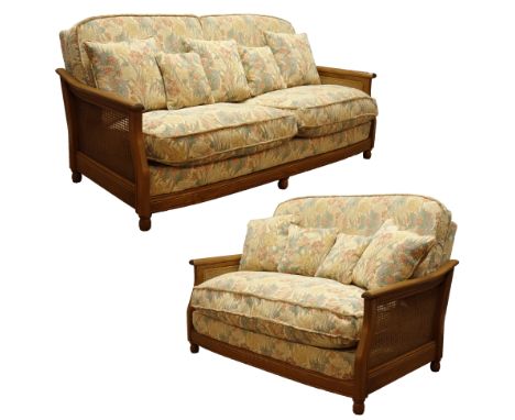 Three piece Ercol bergere lounge suite in golden dawn finish elm - four seat sofa (W190cm, D100cm), and matching two seat sof