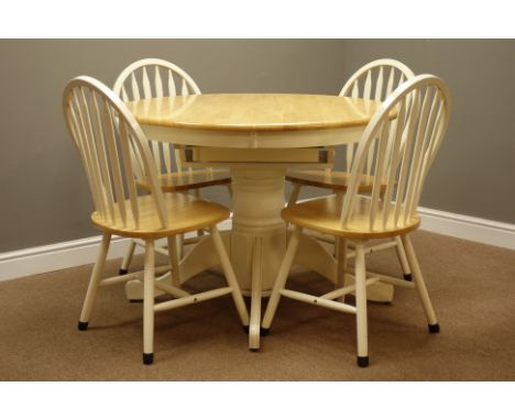 Lightwood circular extending dining table with fold out leaf, on painted turned pedestal with splay legs (D107cm - 152cm, H78