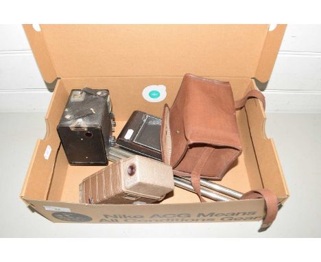 Mixed Lot: A vintage Bell &amp; Howell auto set video camera together with vintage Kodak cameras and a tripod 