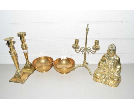 Mixed Lot: A brass Buddha model together with a pair of brass candlesticks, two heavy gauge brass bowls and a further brass t
