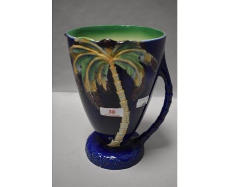 A Beswick 1028 vintage pitcher or water jug with Palm tree and deep blue glaze design 23cm tall