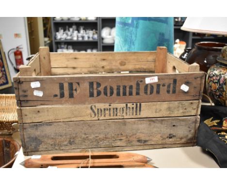 A vintage wooden advertising crate, name JF Bomford-Springhill
