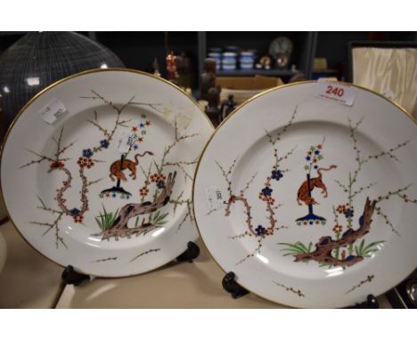 Two early 19th century plates, marked for Derby, having animals depicted to centres with foliate surround, edged in gilt.
