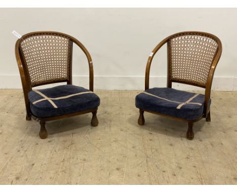 A pair of 1930's bentwood and cane bedroom chairs, with upholstered seat cushions and faceted supports. H70cm.&nbsp;