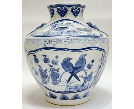 A large modern Chinese blue and white porcelain squat form vase with panel decoration depicting birds and flowers, and ruyie 