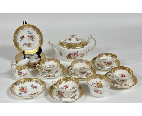 A Hammersley Dresden spray pattern part tea service comprising, a milk jug (h-9cm), five teacups (h-5.5cm), six saucers, a su