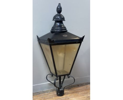 A Victorian style street lantern, black painted copper, of characteristic tapered form, with circular vent finial above appli