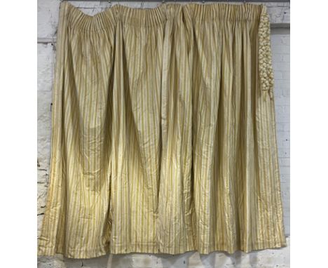 A pair of lined and thermal lined cotton pleated curtains, cream ground decorated with repeating yellow and floral stripes, a