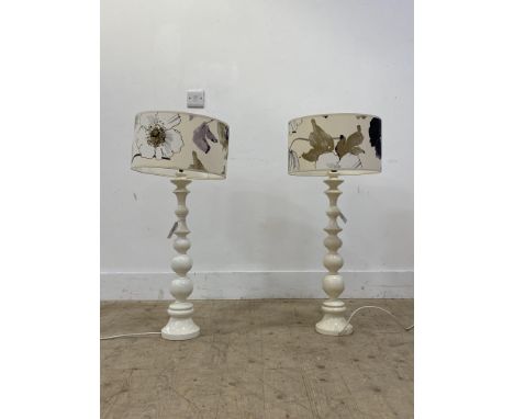A pair of white painted bobbin turned lamp bases. H68cm.&nbsp;