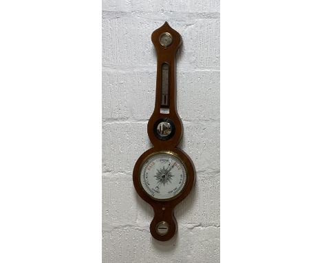 A late Victorian barometer and thermometer in a mahogany banjo pattern case, with silvered registers for dry / damp, level an